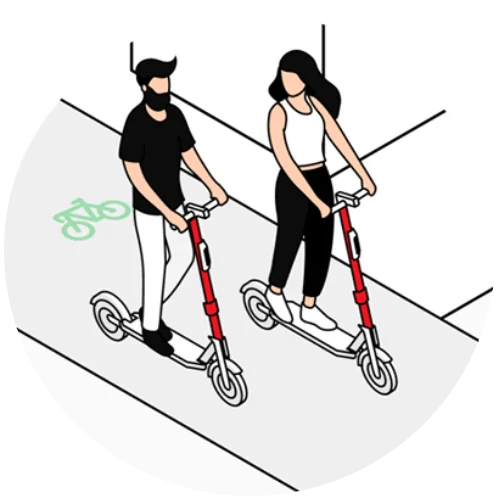 Two riders in a bike lane