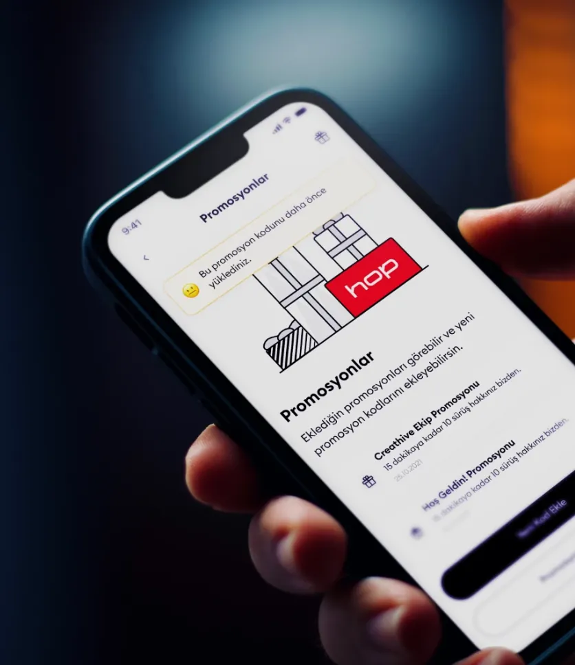 hop app — Promosyonlar (promotions) screen, held in hand